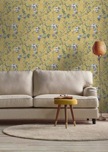 Okkersárga alapon kék és zöld romantikus vintage stílusú vlies tapéta madárral, magnólia és cseresznye virágokkal